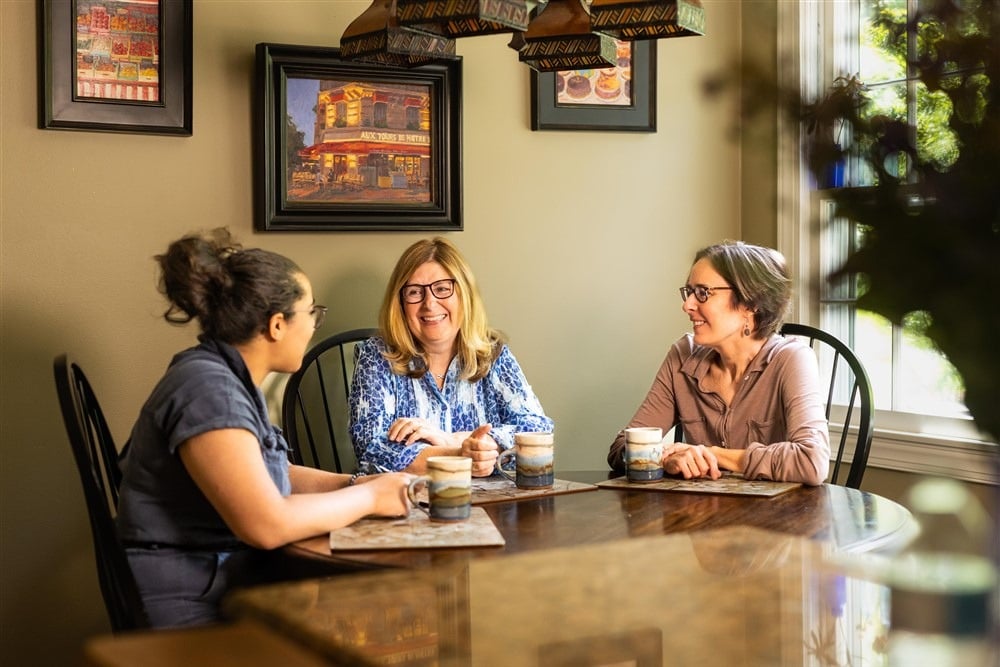 Friends reconnecting over coffee